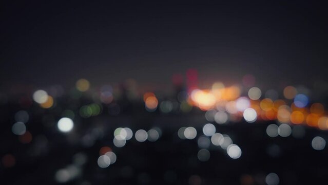 Blurred of night city skyscraper and tower lights bokeh , Soft Focus , Metropolis Backgound wallpaper for movie or documentary romantic mood concept