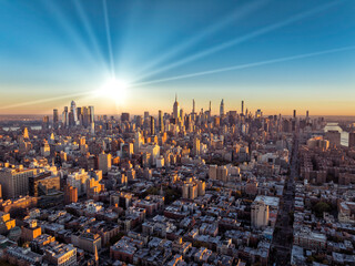 Aerial view of New York City skyline with sun beams - 739054155