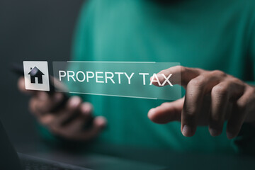 Property Tax concept. real estate management. person use laptop with property tax and house icon.
