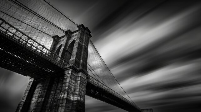 Fototapeta A Dramatic Black and White Shot of a Modern Bridge Against a Backdrop of Clouds, Enshrouded in Nighttime Mystique