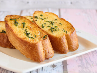 GARLIC BREAD Toast served in dish isolated wooden table top view arabic food appetizer