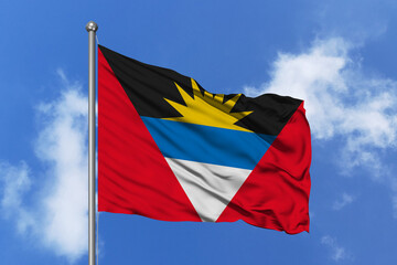 Antigua and Barbuda flag fluttering in the wind on sky.