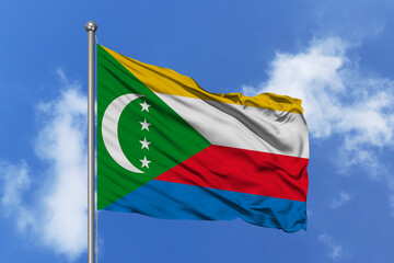 Comoros flag fluttering in the wind on sky.