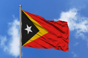 Timor leste flag fluttering in the wind on sky.