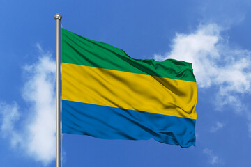 Gabon flag fluttering in the wind on sky.