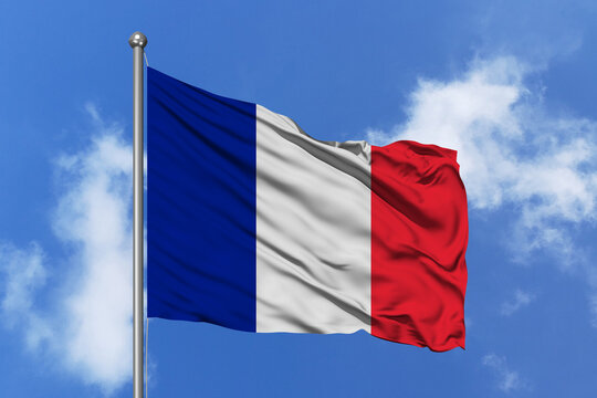 France flag fluttering in the wind on sky.