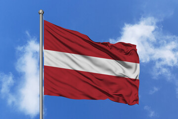 Latvia flag fluttering in the wind on sky.
