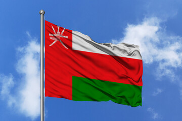 Oman flag fluttering in the wind on sky.