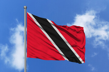 Trinidad and Tobago flag fluttering in the wind on sky.