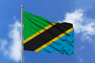 Tanzania flag fluttering in the wind on sky.
