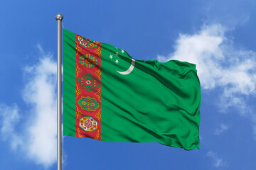Turkmenistan flag fluttering in the wind on sky.