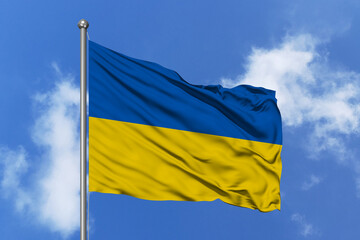Ukraine flag fluttering in the wind on sky.