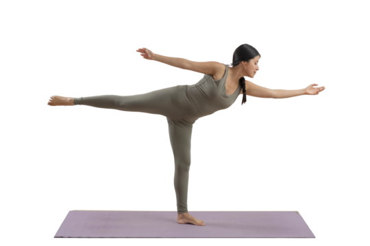 Young mexican woman practicing yoga indoors, standing doing a pose