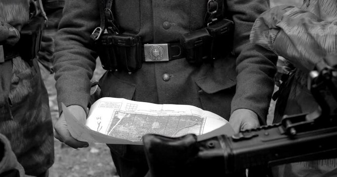 World War II German wehrmacht Soldier officer Commander Soldiers Of World War II Briefs, Showing Direction Of A Attack On Map. Black And White Colors