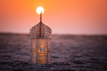 Ramadan Lantern lamp on the beach with sunset view, Ramadan Kareem and Eid Mubarak background