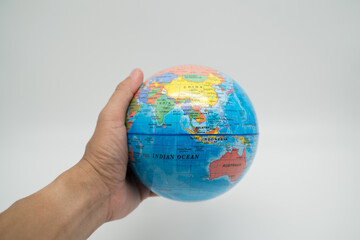 Global holding by hand with white background