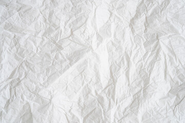 Wrinkled or crumpled white stencil paper or tissue after use with large copy space used for...