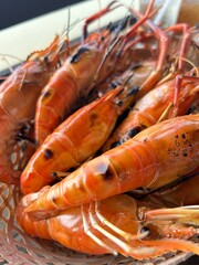Thailand is Kung pao cooked shrimp on a plate, Grilled Giant River Prawn
