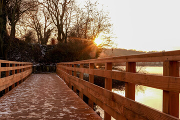 perspective of a wooden pontoon on a lake in winter