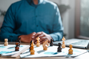 business, management, planning, strategy, chart, plan, leader, manager, chess, professional. businessman put on casual suit in front of chess piece on document with chart progress to hit the goal.