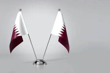 Fotobehang Double State of Qatar Table Flag on Gray Background. 3d Rendering © klenger