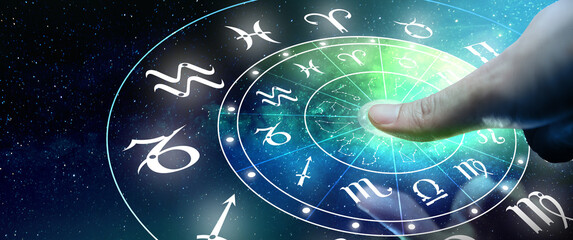 Astrological zodiac signs inside of horoscope circle. Man or Woman touching screen Zodiac signs...