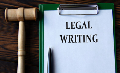 LEGAL WRITING - words on a white sheet with a judge's gavel - obrazy, fototapety, plakaty