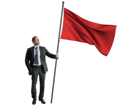 Confident businessman looking upwards, holding a large red flag, isolated on white