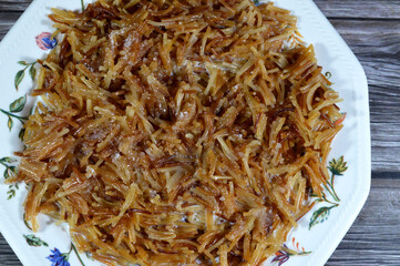 browned in Butter sweet Egyptian vermicelli cooked with water and sugar in a cooking pot, milk and...