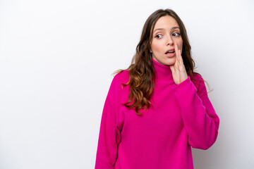 Young caucasian woman isolated on white background whispering something with surprise gesture while looking to the side