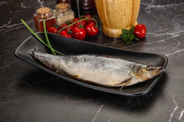 Whole raw salted herring fish