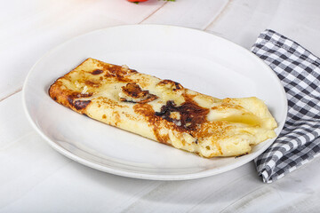 Sweet pancake with banana and honey