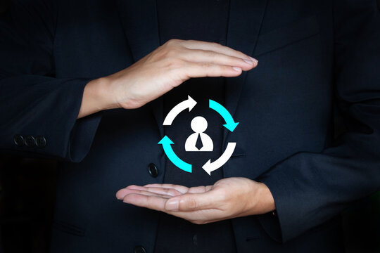 Customer retention and customer care icon on hand of business man; Human resource management; Staff turnover or job rotation concept
