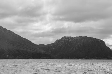 clouds over mountains over the water in a national park and beautiful rock mountain above the ocean in a national park