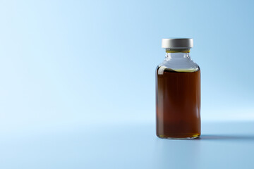 syringe for injectable medication on blue background