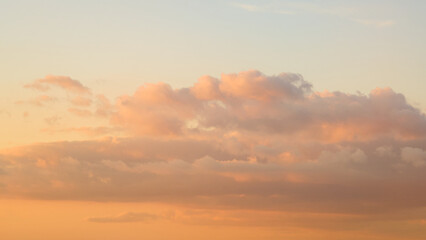 As the sun sets, the sky transforms into a breathtaking display of majestic clouds.