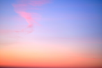 Clear transparent cirrus clouds on a red sunset sky