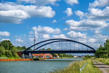 Bridge over canal and small houseboat