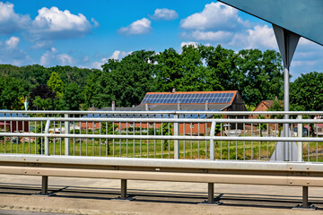 Fototapeta na wymiar Solar panels and solar cells on bridge over highway