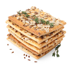 Stack of cereal crackers with flax, sunflower, sesame seeds and thyme isolated on white
