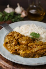 Delicious chicken curry with rice on table, closeup