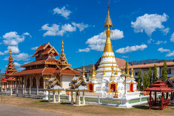 Shan temple architecture at Wat Hua Wiang in Mae Hong Son town, Northern Thailand. The Chedi and the Vihara with the impressive tiered roof are build in the Burmese style