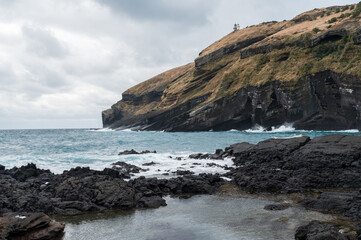 Jeju Island's natural scenery on a cloudy day by the sea.