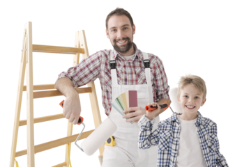Father and son painting walls and posing
