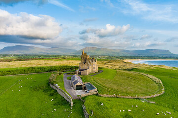 Classiebawn Castle on a backdrop of picturesque landscape of Mullaghmore Head. Spectacular sunset...