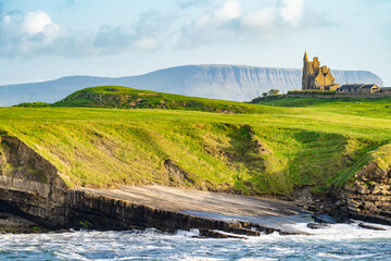 Famous Classiebawn Castle in picturesque landscape of Mullaghmore Head. Spectacular sunset view...