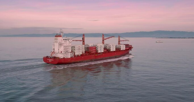 Aerial: Cargo ship in the San Francisco Harbor, USA