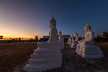 White Buddha statue in the temple in the morning