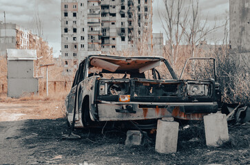damaged and looted cars in a city in Ukraine during the war