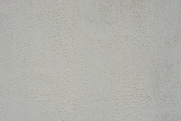 Building materials, street wall cladding, coating in the form of a white rough structure. 